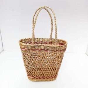 Reed net bag made out of reed , light brown in color