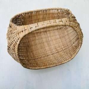 Shopping basket made out of cane light brown color