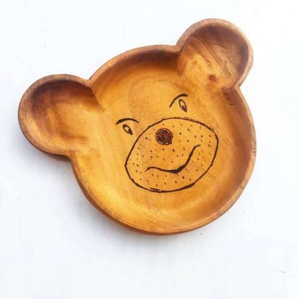 Wood kids plate in brown color made like a bear face to make eating more interesting